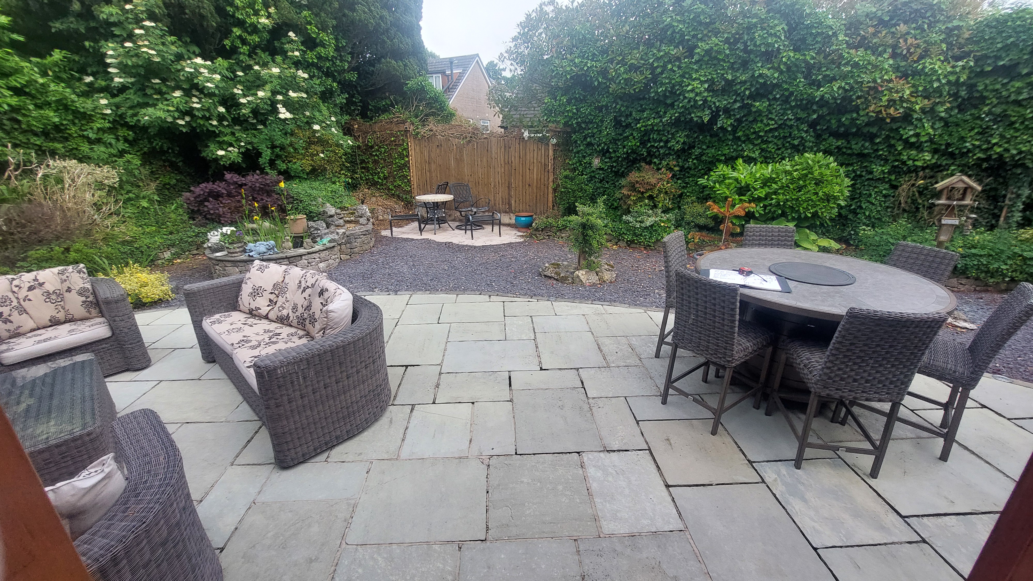 Before photo of garden viewed from patio doors